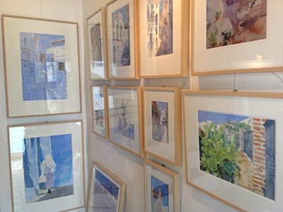 Photo of the interior of the art studio with watercolours, books and calendar